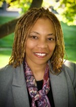 Portrait of Lezlie Thompson smiling at the camera.