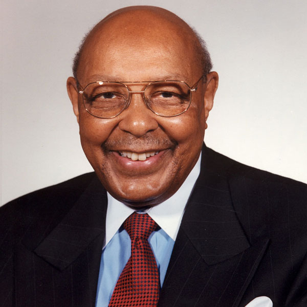 Portrait of Louis Stokes smiling at the camera.