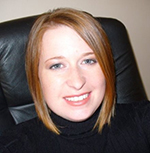 Portrait of Dani Mitchell smiling at the camera.